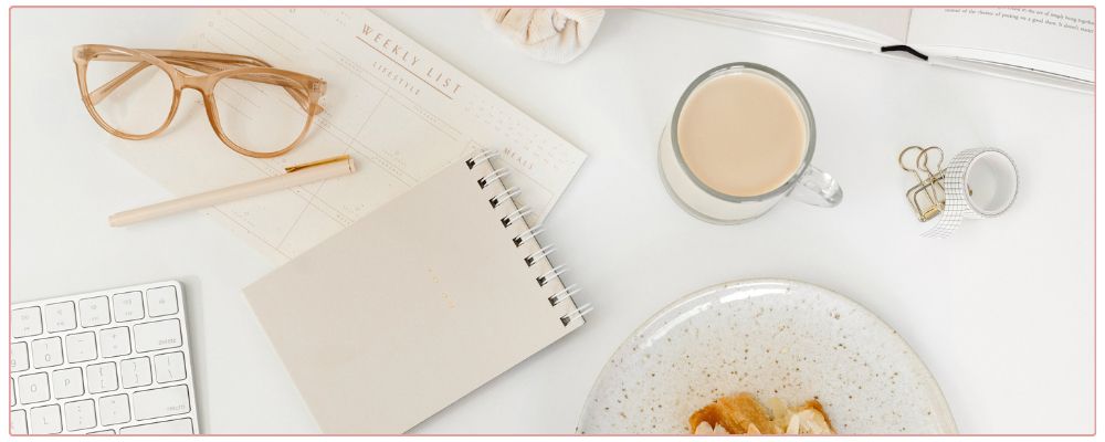 Woman at her desk feeling overwhelmed.
