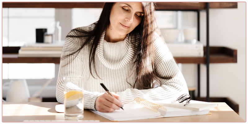 Joelene Mills Business Coach Getting over Self-doubt, Woman working at her desk